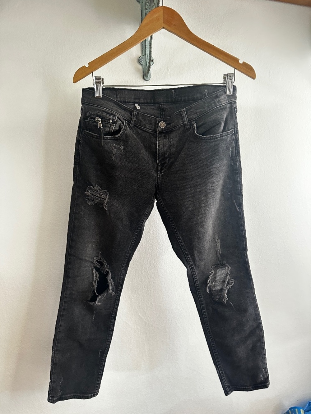 Beat up black jeans